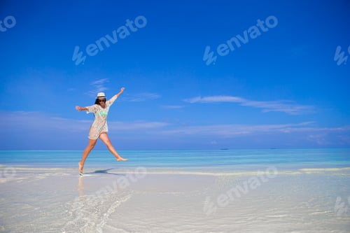 Preview: Young woman enjoy tropical beach vacation on Maldives