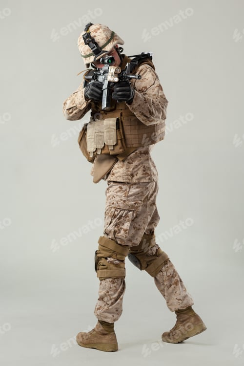 Preview: Military personnel in tactical gear training with a weapon indoors