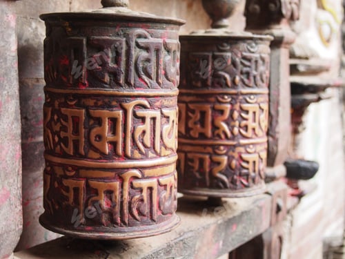 Preview: Closeup shot of traditional prayer wheels near a temple in Nepal