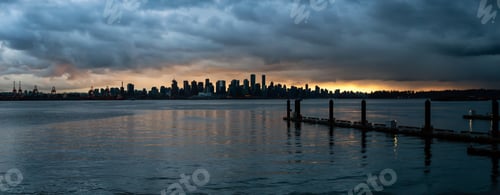 Preview: Panoramic view of Downtown City Skyline during a striking and dramatic sunset