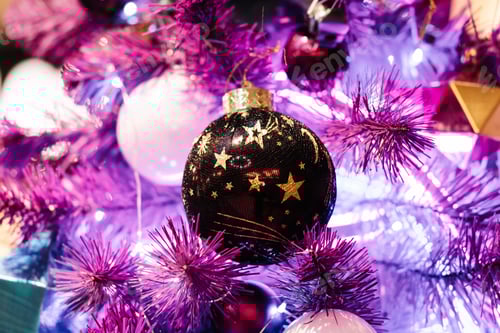 Preview: Christmas balls on a purple christmas tree