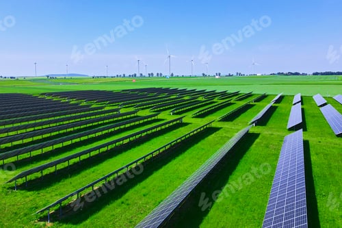 Preview: Solar panels in green field, aerial view