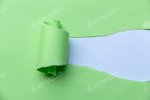 Preview: Green Torn Paper Revealing white empty space for text or logo.