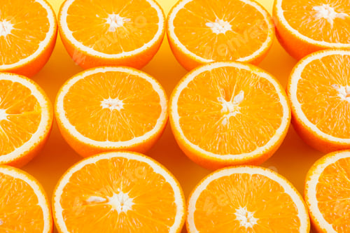 Preview: Cut Halves Of Juicy Orange On Yellow Background. Orange Fruit, Citrus Minimal Concept. Creative