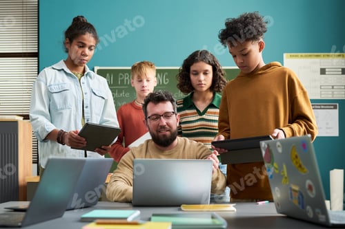 Preview: Caucasian Man Teaching Diverse Teenagers Using Digital Tablets
