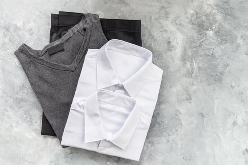 Preview: Back to school concept with uniform and electronic devices