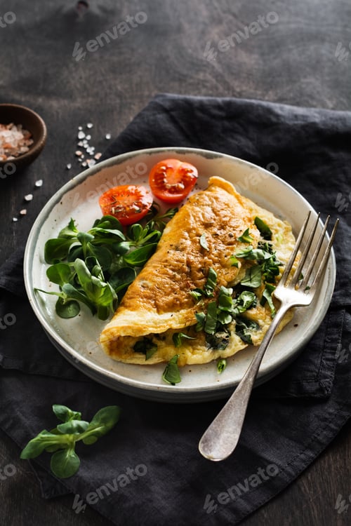 Preview: Stuffed omelette with tomatoes, red bell pepper, cream cheese and corn or lamb's lettuce on dark woo