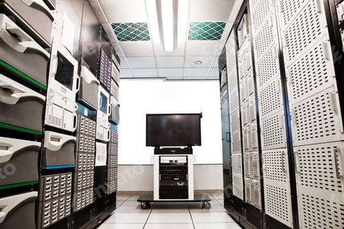 Preview: Storage racks aligned in a computer server room.