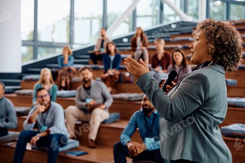 Preview: Female speaker talking on a business conference at convention center.