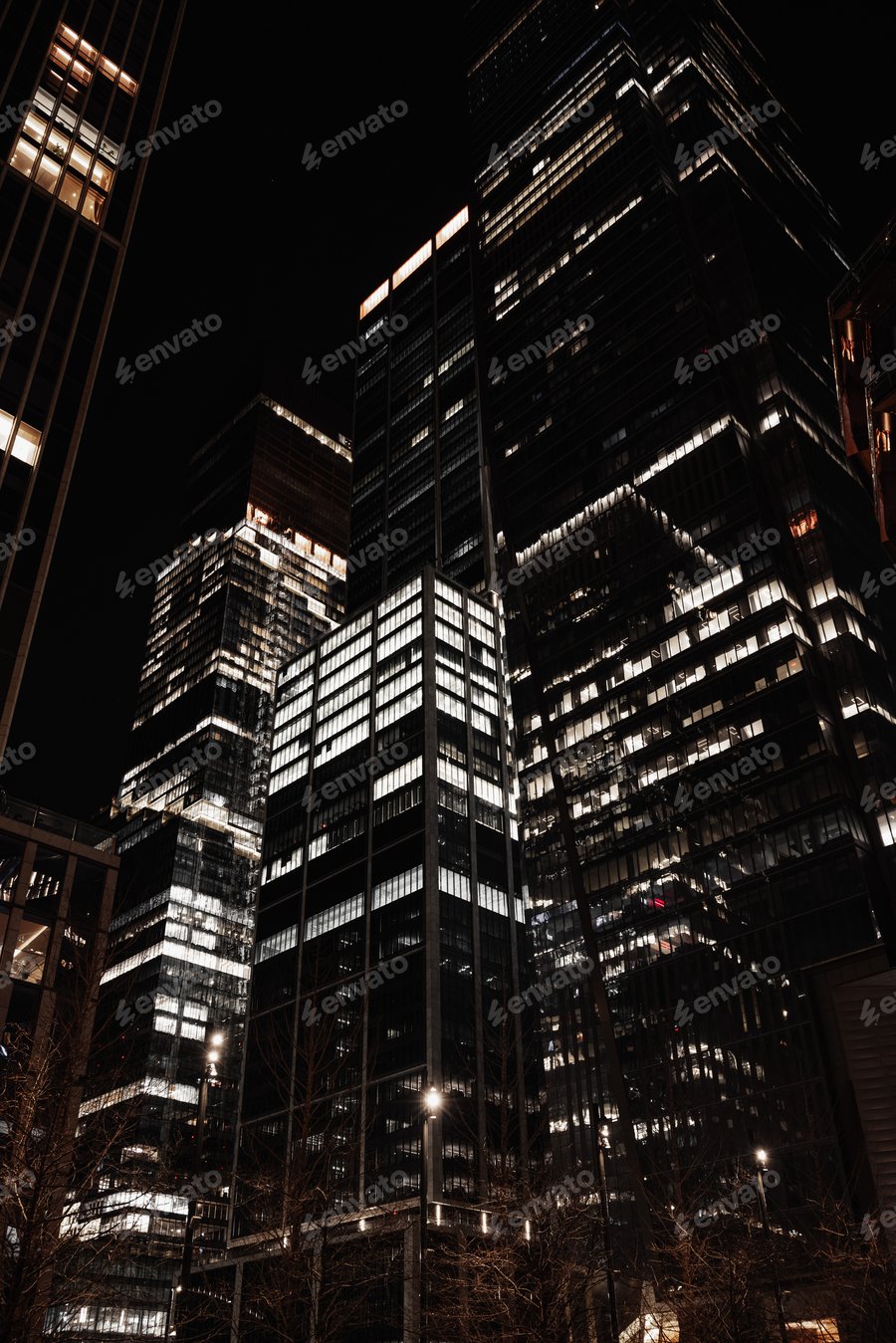 Cover for Urban cityscape at night with illuminated skyscrapers against the dark night sky