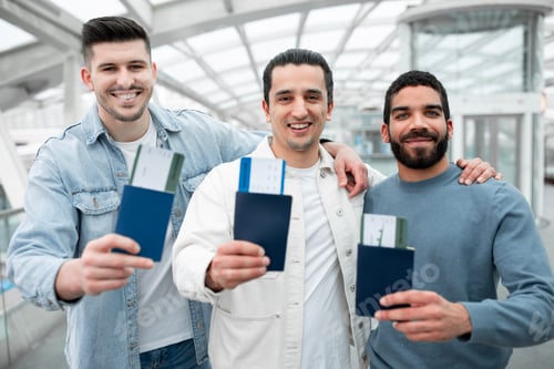 Preview: Three Guys Travelers Embracing At Airport Indoor Showing Their Passports