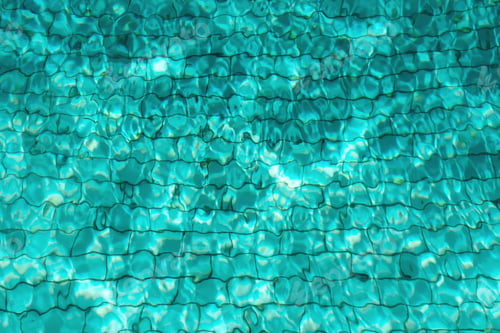 Preview: Turquoise swimming pool water background. Copy space, top view. Close up abstract water texture