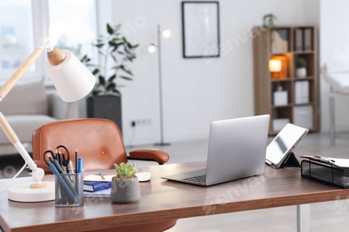 Preview: Doctor's workplace with modern laptop on desk in office