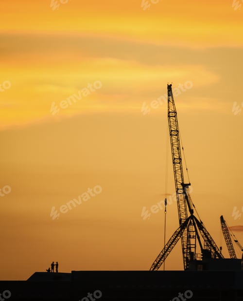 Preview: Silhouette people discussing at construction site in the dawn