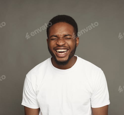 Man Laughing with Eyes Closed in Studio