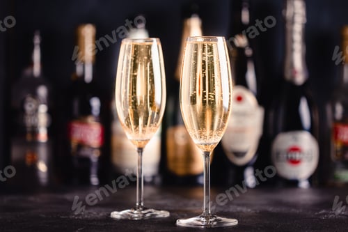 Preview: Champagne glasses on a dark background.