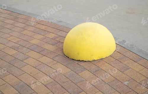 Preview: Yellow restrictive hemisphere to protect the pedestrian zone from parking. Safe urban environment.