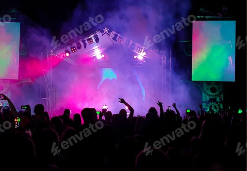 Preview: A crowd of fans at a concert under the spotlight. A scene with musicians