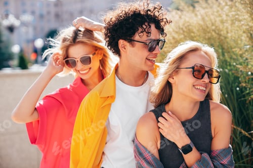 Preview: Man and two women outdoors