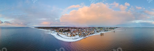 Preview: Drone view of the Lighthouse of Urk during winter with snow in the Netherlands