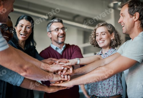 Preview: Shot of a group of businesspeople joining their hands together in unity