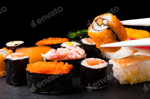 Preview: Sushi set on black background, Japanese food.