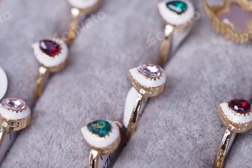 Preview: Colorful gemstone rings displayed on soft fabric for sale