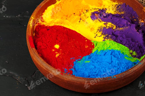 Preview: Indian Holi festival colours in small bowls on dark background