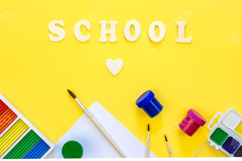 Preview: Colourful school supplies on a yellow background, back to school concept, top view.