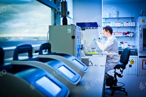 Preview: Scientist using computer in lab