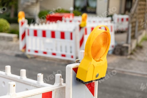 Preview: construction site sign cordoning off on a road