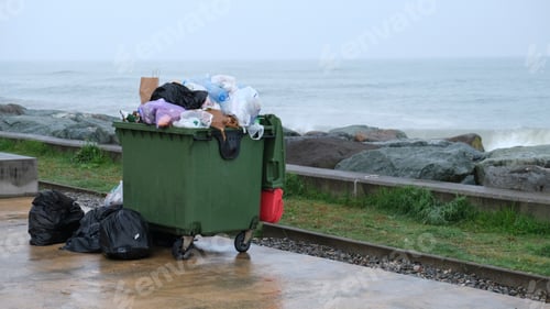 Preview: Full dumpsters garbage containers standing ear sea. Environmental, Ecology.