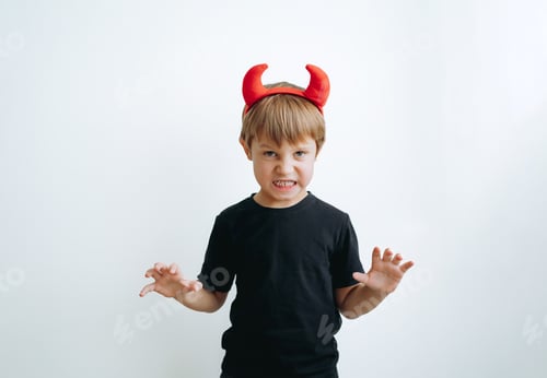 Preview: Halloween concept. cute little boy with red devil horns isolated on white background