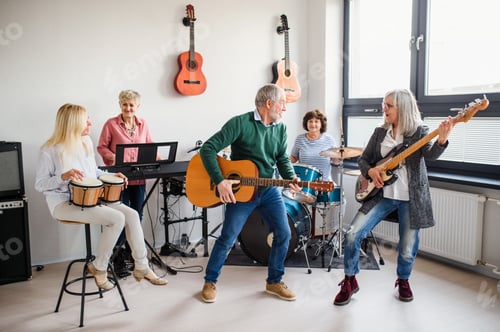 Preview: Group of senior people playing musical instruments indoors in band