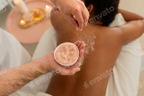 Preview: African American lady enjoys back scrub at spa