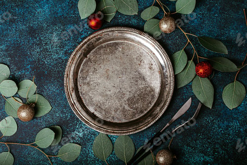 Preview: Empty metal plate top view on Christmas table