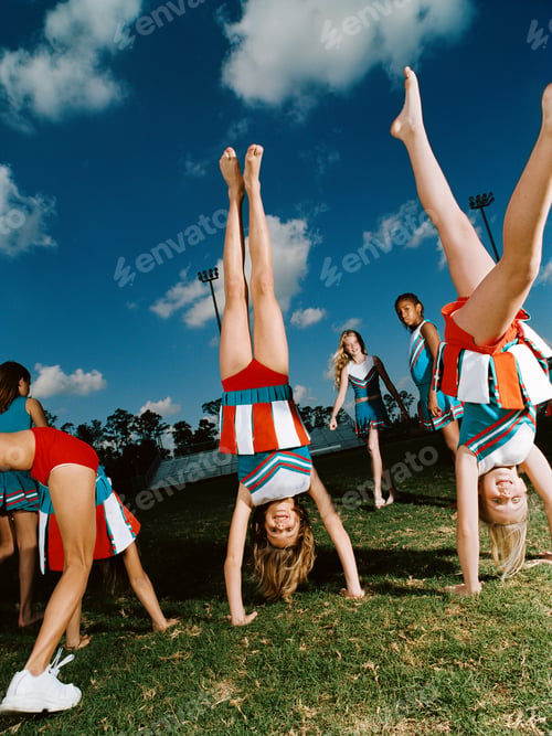 Preview: Cheerleaders performing handstands on pitch