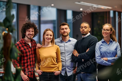Preview: Portrait of successful creative business team looking at camera and smiling. Diverse business people