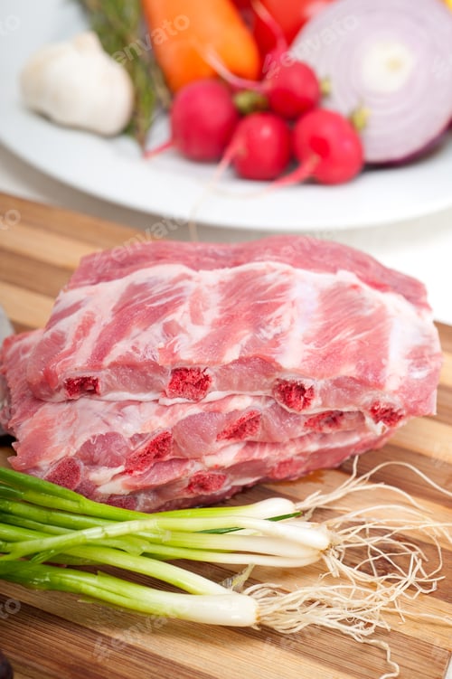 Preview: chopping fresh pork ribs and vegetables