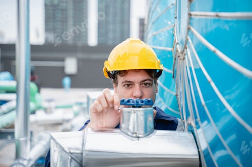 Preview: Engineer is checking the cooling system for the air conditioning in building or industrial building.