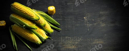 Preview: Corn on dark table.