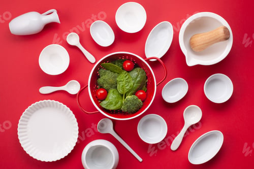 Preview: White tableware and kitchen utensils over the reg backgtound. Mockup, cooking blog, classes concept