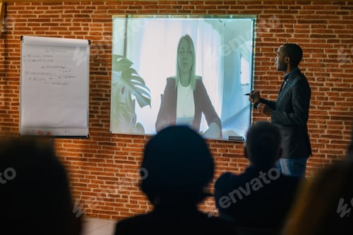 Preview: Side view of African American businessman showing video call dur