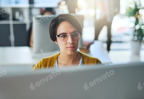 Preview: Cropped shot of a young businesswoman working in a modern office