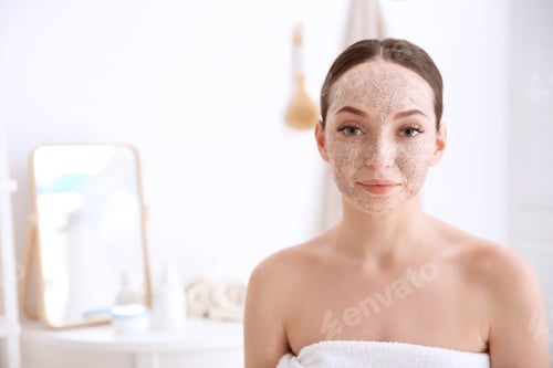 Preview: Woman with scrub on face in bathroom