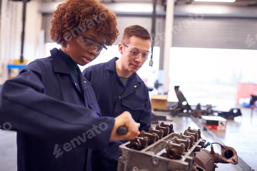 Preview: Male And Female Students Work On Car Engine Block On Auto Mechanic Apprenticeship Course At College
