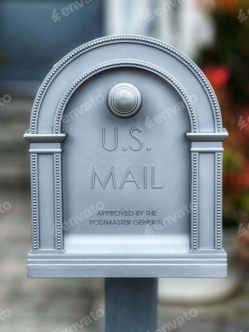 Preview: silver mailbox outside a house
