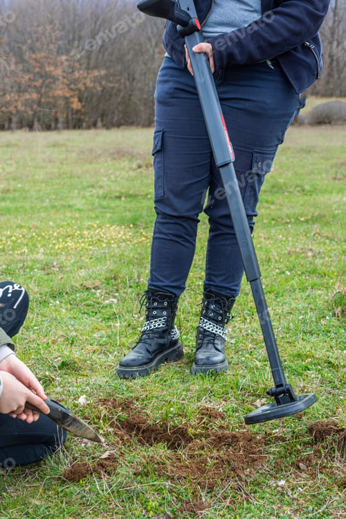 Preview: Kids treasure hunters metal detecting and digging the ground