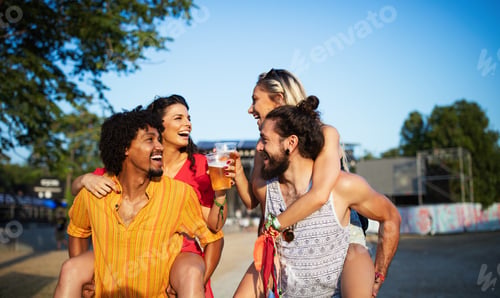 Preview: Group of friends having fun time at music festival