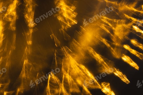Preview: Yellow bokeh blurred lights with copy space on dark background